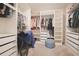 Expansive walk-in closet with custom shelving offering ample storage for wardrobe and accessories at 2168 Marsh Sedge Ln, Winter Park, FL 32792