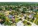 Aerial shot of a neighborhood featuring a charming home outlined in red, surrounded by tree-lined streets at 2412 Yule Tree Dr, Edgewater, FL 32141