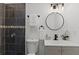 Updated bathroom featuring tile shower, modern vanity, and stylish fixtures at 2412 Yule Tree Dr, Edgewater, FL 32141