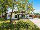 Well-maintained home showcasing fresh landscaping and a spacious front yard, offering a picturesque view at 2412 Yule Tree Dr, Edgewater, FL 32141