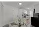 Bright, compact eat-in kitchen, with white cabinetry, stainless appliances, and a modern glass table at 2412 Yule Tree Dr, Edgewater, FL 32141