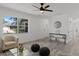 Spacious living room with an abundance of natural light, modern decor, and stylish furnishings at 2412 Yule Tree Dr, Edgewater, FL 32141