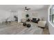 Bright living room featuring contemporary furniture, neutral tones, and stylish decor, creating a comfortable living space at 2412 Yule Tree Dr, Edgewater, FL 32141