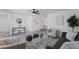 Open-concept living room boasting a modern design, stylish furniture, and plenty of natural light for a welcoming feel at 2412 Yule Tree Dr, Edgewater, FL 32141