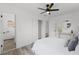 Bedroom featuring wood floors, white walls, closet, and bright light at 2412 Yule Tree Dr, Edgewater, FL 32141