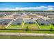 Aerial view of a property highlighting the backyard, neighboring homes, and community layout at 284 Talladega Ln, Polk City, FL 33868