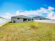 The private, fenced backyard offers plenty of green space at 284 Talladega Ln, Polk City, FL 33868