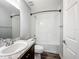 Clean bathroom featuring a single vanity, a toilet, and a shower-tub combo at 284 Talladega Ln, Polk City, FL 33868