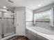 Bathroom with a walk-in shower and a separate soaking tub at 284 Talladega Ln, Polk City, FL 33868