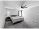 Bedroom with neutral walls, carpet, ceiling fan, and natural light at 284 Talladega Ln, Polk City, FL 33868