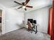 Bedroom featuring neutral paint, plush carpeting, and a dedicated workstation at 284 Talladega Ln, Polk City, FL 33868
