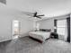 Spacious bedroom with neutral walls, ceiling fan, and connecting bath at 284 Talladega Ln, Polk City, FL 33868