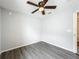 Bedroom with luxury vinyl plank flooring, a ceiling fan, and neutral colored walls at 284 Talladega Ln, Polk City, FL 33868
