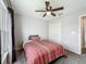 Comfortable bedroom with neutral walls, plush carpeting, and a double door closet at 284 Talladega Ln, Polk City, FL 33868