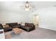 Relaxing living room area with a cozy sectional sofa, area rug, and a neutral color palette at 284 Talladega Ln, Polk City, FL 33868