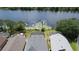 Aerial perspective capturing homes nestled along a tranquil lake with lily pads and lush greenery at 2889 Blooming Alamanda Loop, Kissimmee, FL 34747