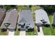 Aerial view of the homes showing well-manicured lawns and proximity to a beautiful, tranquil lake at 2889 Blooming Alamanda Loop, Kissimmee, FL 34747