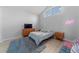 Cozy bedroom featuring a vaulted ceiling, a plush rug, and modern furnishings at 2889 Blooming Alamanda Loop, Kissimmee, FL 34747