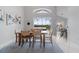 Bright dining area with large windows overlooking the screened-in pool, with counter seating nearby at 2889 Blooming Alamanda Loop, Kissimmee, FL 34747