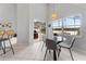 Bright dining area with views of the lake, pool, and outdoor patio space at 2889 Blooming Alamanda Loop, Kissimmee, FL 34747