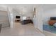Bright living room with high ceilings, tile flooring and neutral tones at 2889 Blooming Alamanda Loop, Kissimmee, FL 34747