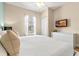 Cozy bedroom with white bedding, neutral walls, and a mounted TV, perfect for relaxing at 2952 Lucayan Harbour Cir # 106, Kissimmee, FL 34746