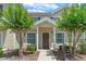 Inviting two-story home entrance with landscaped pathway and traditional architecture at 2952 Lucayan Harbour Cir # 106, Kissimmee, FL 34746