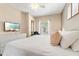 Serene bedroom featuring a queen-size bed, TV, and relaxing ambiance at 2952 Lucayan Harbour Cir # 106, Kissimmee, FL 34746