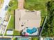 Overhead image showcasing the home's roof, pool area, surrounding yard and well-maintained landscaping at 30 Capistrano Dr, Ormond Beach, FL 32176