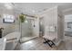 Elegant bathroom with a soaking tub, glass shower, and wood-look tile flooring at 30 Capistrano Dr, Ormond Beach, FL 32176