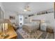 Cozy bedroom with a ceiling fan, bright windows, and a comfortable rug at 30 Capistrano Dr, Ormond Beach, FL 32176