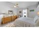 Bright bedroom featuring two dressers, neutral color scheme and a ceiling fan at 30 Capistrano Dr, Ormond Beach, FL 32176
