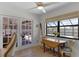 Dining area with french doors to an outdoor patio and a large window with views of the pool at 30 Capistrano Dr, Ormond Beach, FL 32176