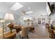 Bright and open living space with a fireplace, modern lighting, and skylights above at 30 Capistrano Dr, Ormond Beach, FL 32176