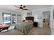 Cozy main bedroom with outdoor access, neutral decor, ceiling fan, and a relaxing atmosphere at 30 Capistrano Dr, Ormond Beach, FL 32176