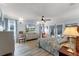 Serene main bedroom with light blue walls, soft lighting, tv, and sliding doors to the outdoors at 30 Capistrano Dr, Ormond Beach, FL 32176