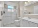 Clean bathroom with white vanity, shower, and tile, complemented by modern fixtures at 339 Hammock Dunes Pl, Orlando, FL 32828
