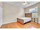 Comfortable bedroom boasting hardwood floors and a bright window for natural light at 339 Hammock Dunes Pl, Orlando, FL 32828