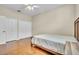 Minimalist bedroom featuring light hardwood floors, bright natural light, and a neutral color scheme at 339 Hammock Dunes Pl, Orlando, FL 32828