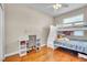 Bright bedroom includes a bunk bed, desk, chair and hardwood flooring at 339 Hammock Dunes Pl, Orlando, FL 32828