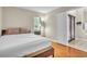 Inviting bedroom featuring warm hardwood floors and plenty of natural light at 339 Hammock Dunes Pl, Orlando, FL 32828