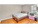 Cozy bedroom with hardwood floors, lots of natural light, and a minimalist style at 339 Hammock Dunes Pl, Orlando, FL 32828