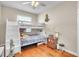 Cozy bedroom includes a bunk bed, hardwood flooring, and window with natural light at 339 Hammock Dunes Pl, Orlando, FL 32828