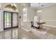 Bright dining area featuring tiled flooring, arched windows, and contemporary chandelier at 339 Hammock Dunes Pl, Orlando, FL 32828