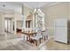 Dining area with tile flooring, chandelier, and views of a bedroom through doorway at 339 Hammock Dunes Pl, Orlando, FL 32828