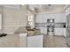 Beautiful kitchen with granite countertops, stainless steel appliances, and white cabinets at 339 Hammock Dunes Pl, Orlando, FL 32828