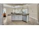 Spacious kitchen with granite counters, stainless steel dishwasher, and open view to the living area at 339 Hammock Dunes Pl, Orlando, FL 32828