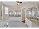 Bright bathroom showcasing granite counters, generous vanity space, and an inviting, open layout at 339 Hammock Dunes Pl, Orlando, FL 32828