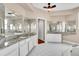 Elegant bathroom featuring granite countertops, generous vanity space, and a large, bright mirror at 339 Hammock Dunes Pl, Orlando, FL 32828