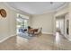 Home office with tiled floors, a ceiling fan, and a sliding glass door leading to the patio at 339 Hammock Dunes Pl, Orlando, FL 32828